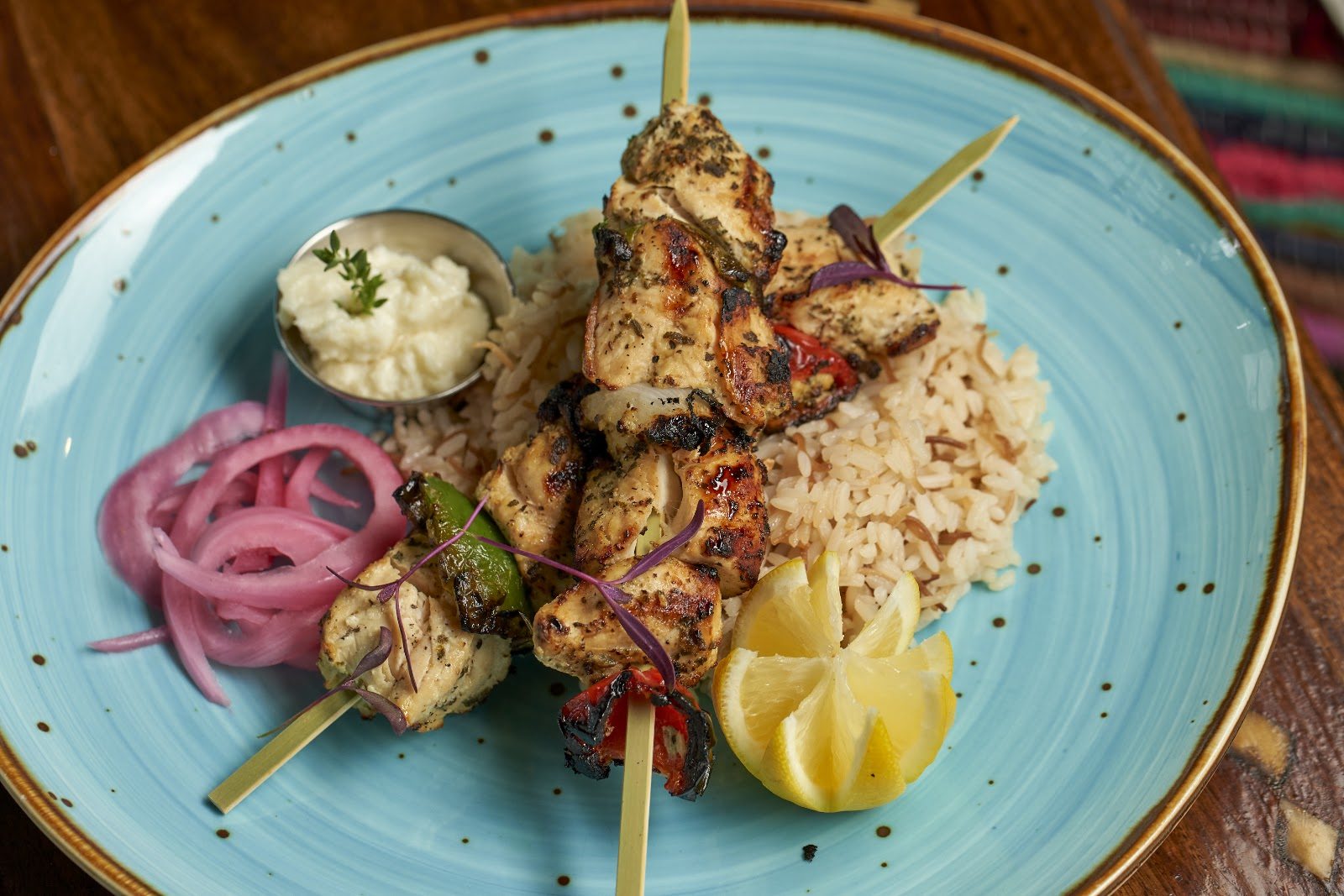 Chicken Kabab skewers with pickled onion at Layali Miami