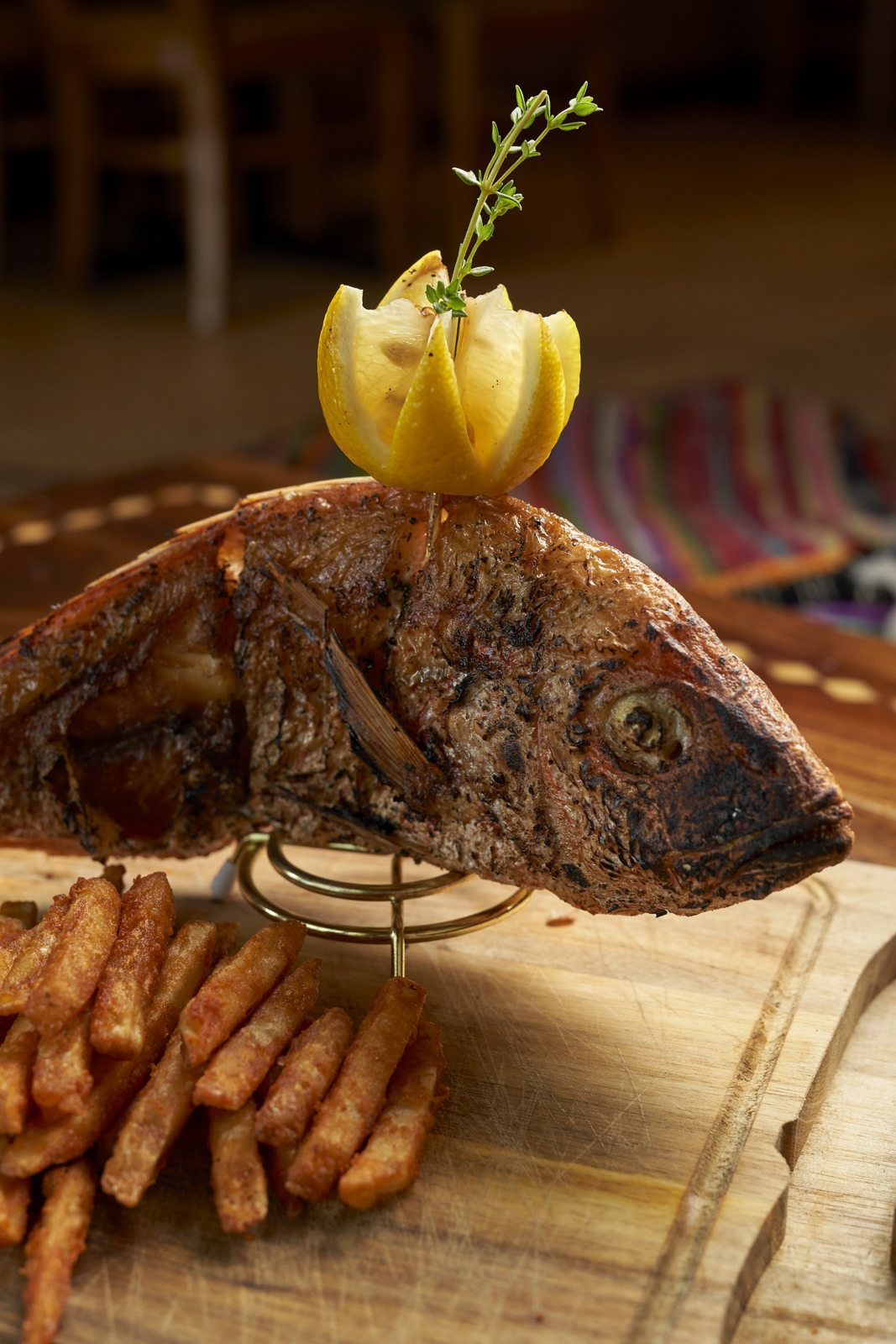 Crispy Red Snapper with house spices and fries at Layali Miami