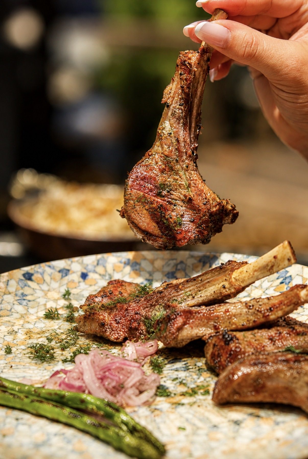 Grilled lamb chops with asparagus at Layali Miami