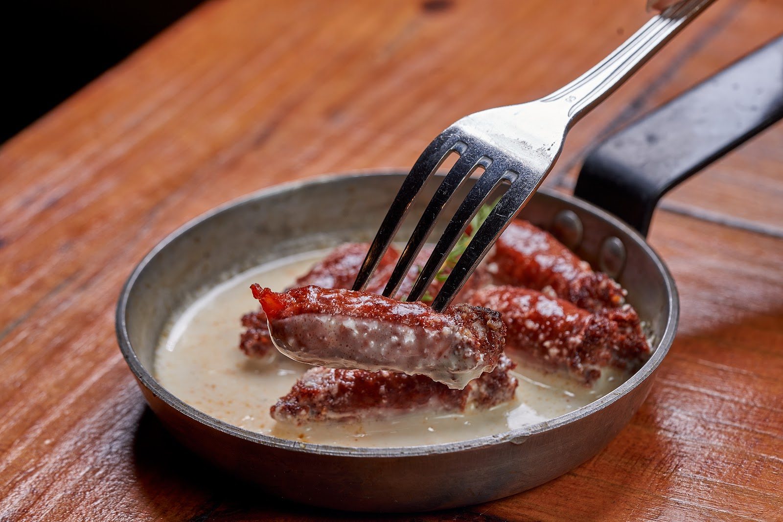 Makanek Lebanese sausages with pomegranate glaze at Layali Miami