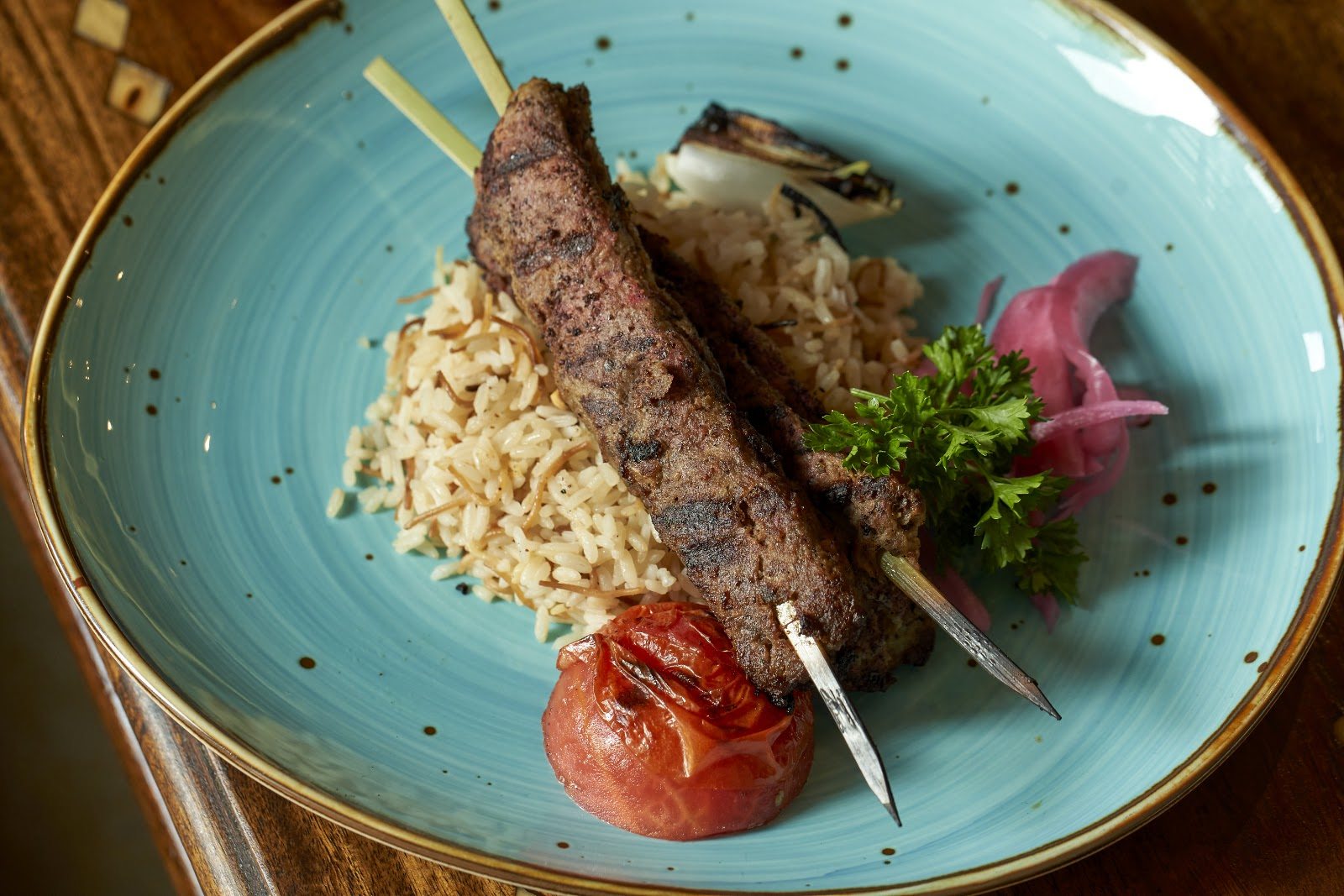 Seasoned Meat Kafta Kabab skewers with rice at Layali Miami