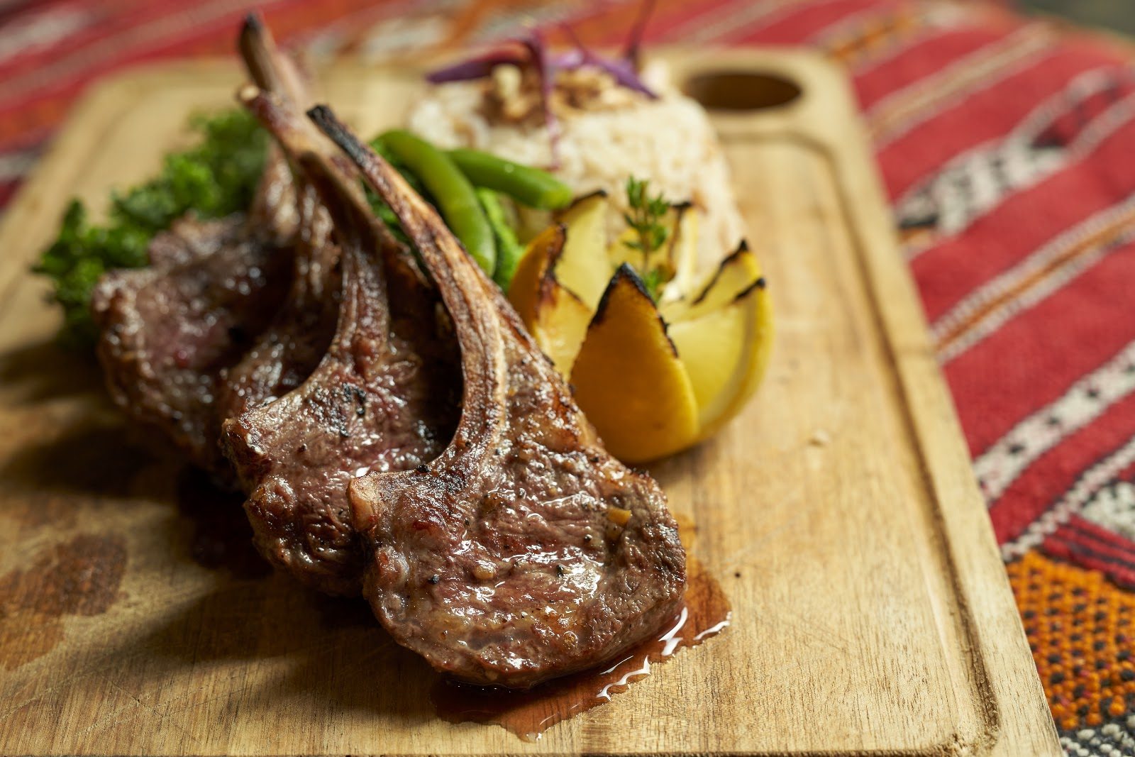 Grilled Rack of Lamb with rice and asparagus at Layali Miami